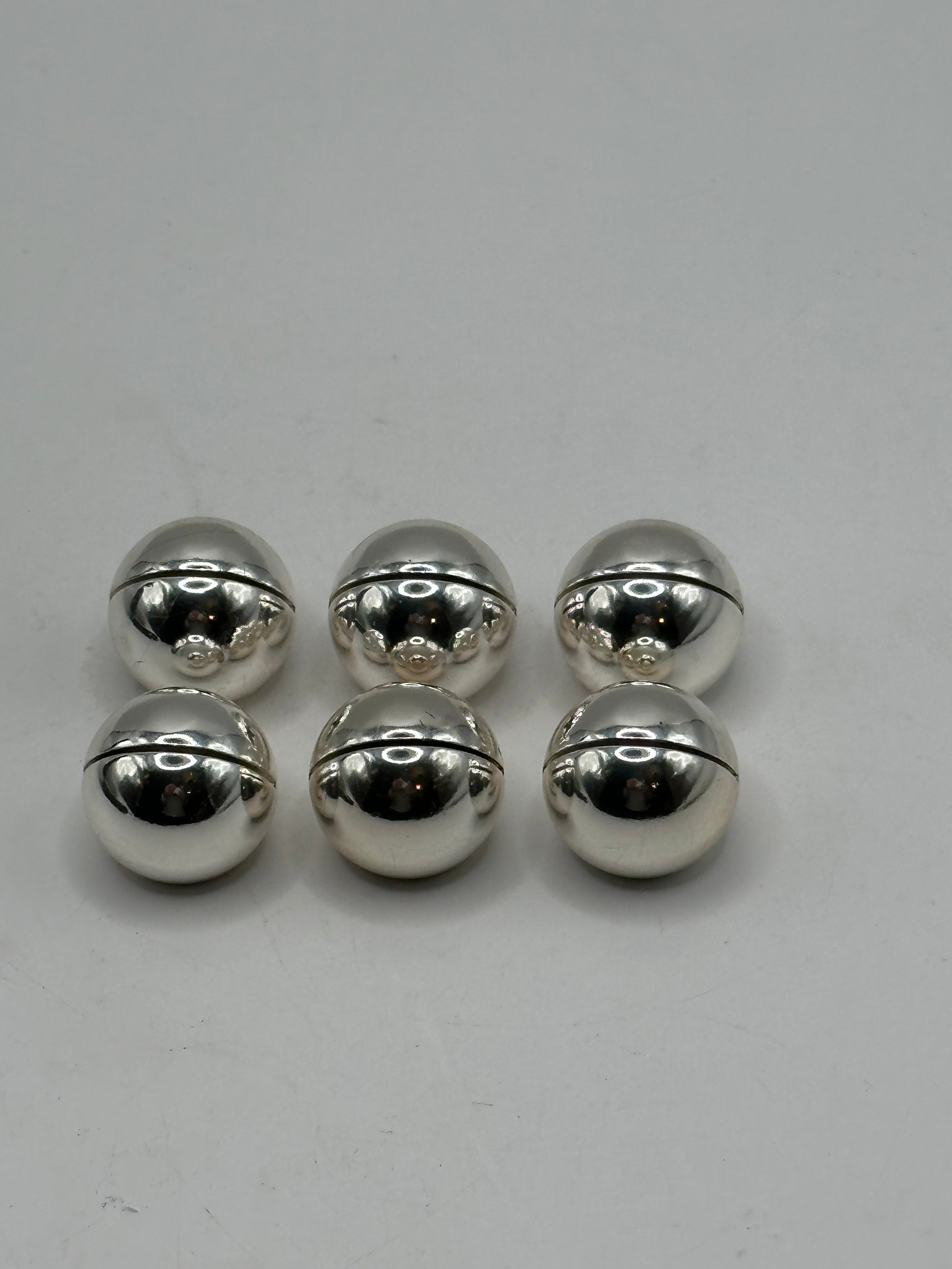 MCM stainless steel spherical place card holders, six spheres showing the horizontal card slot