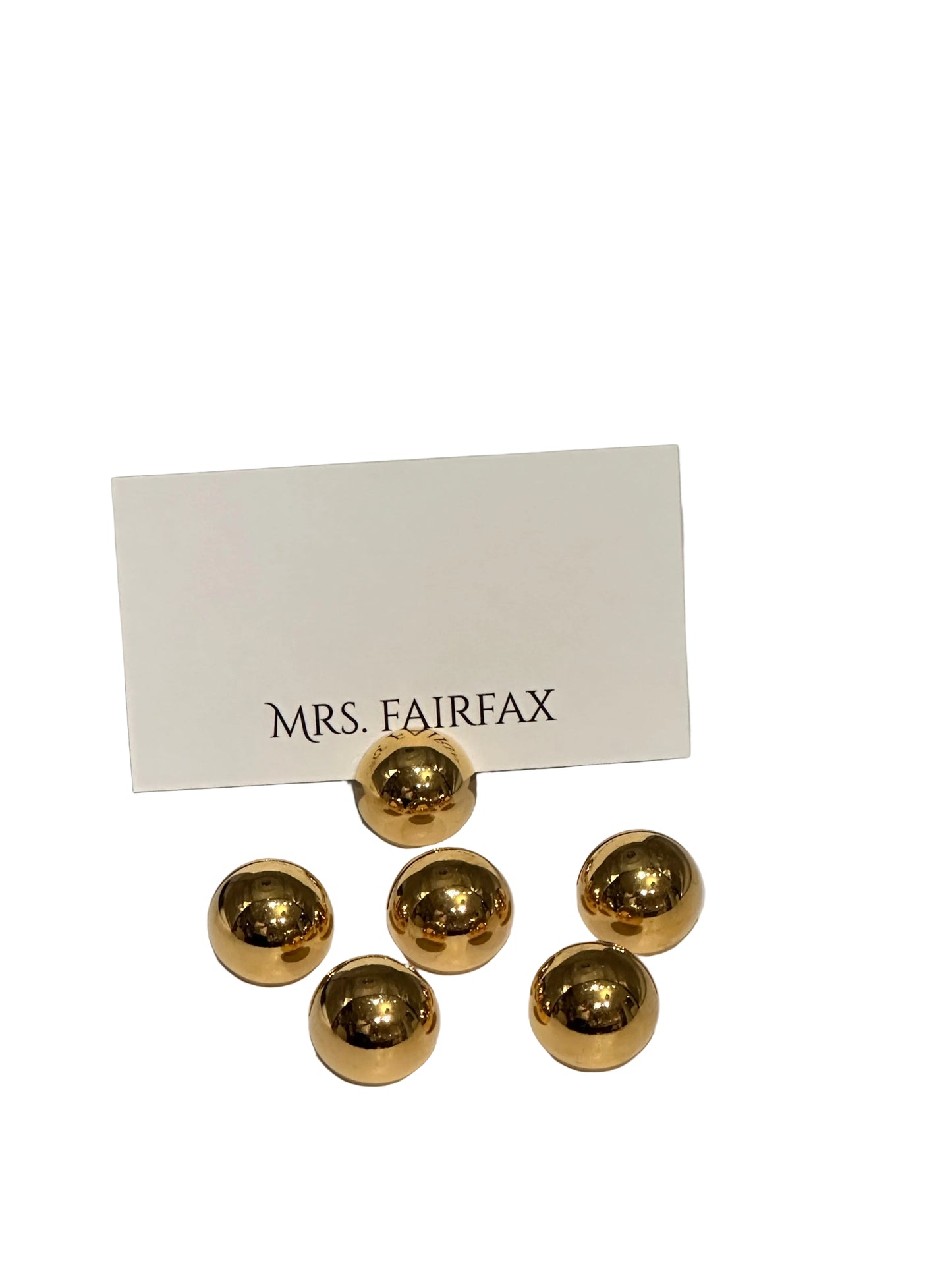 MCM brass spherical place card holders, six polished brass spheres with one holding a place card