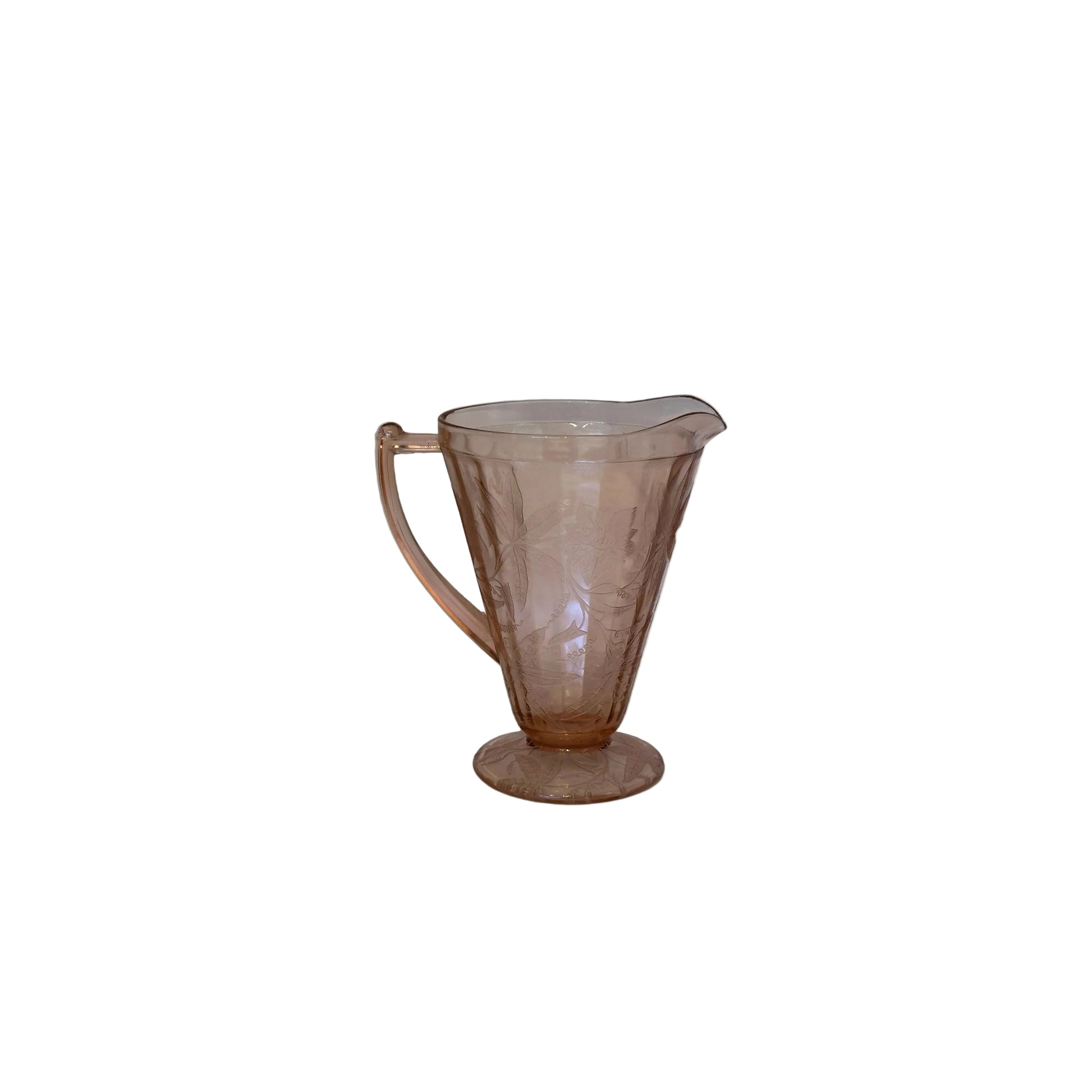 Pink Depression glass pitcher by Jeannette Glass, footed with etched floral pattern, front view