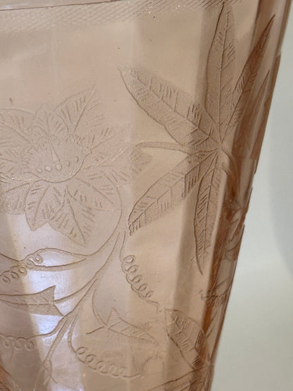 Close-up of etched floral and leaf pattern on pink Depression glass pitcher
