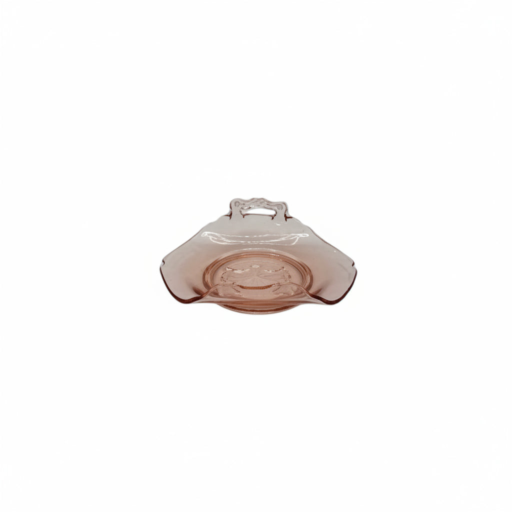 Pink depression glass handled dish, low side view on white