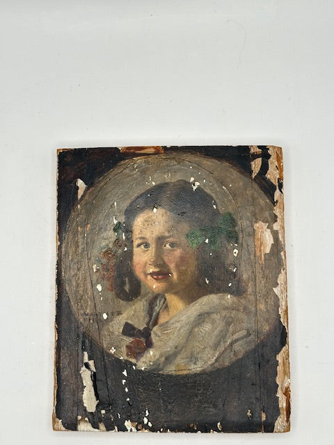 Angled view of the Firle portrait on board showing oval framing and flaking paint