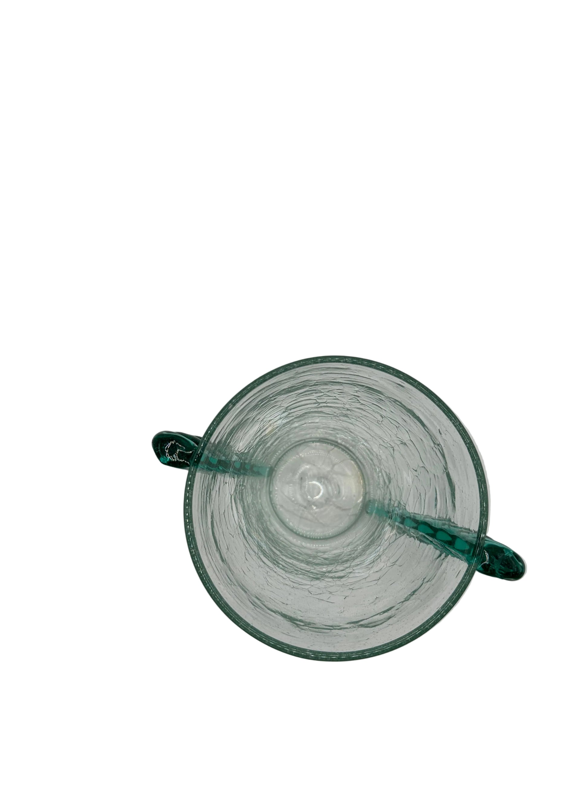 Top-down view into the MCM Blenko vase opening with two applied teal rope handles