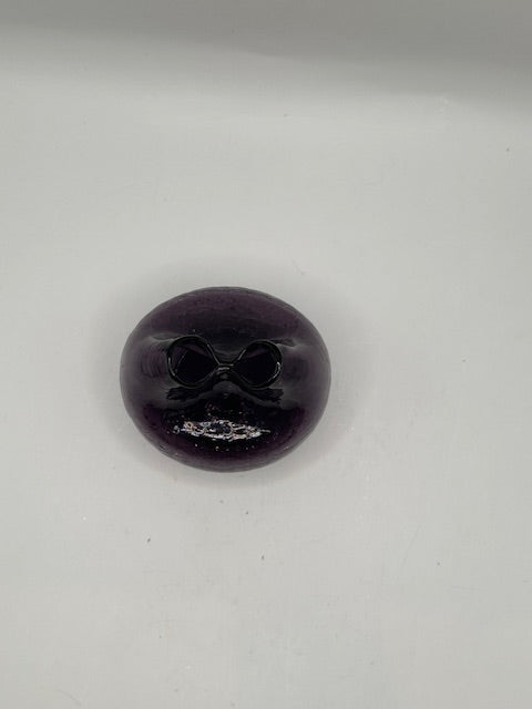 Overhead view of the amethyst Blenko vase showing the pinched folded opening