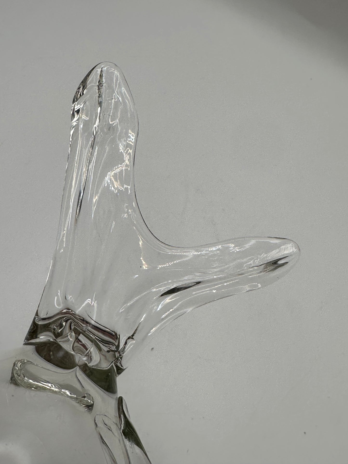 Close-up of the Blenko glass fish vase tail, clear hand-blown glass with flowing form