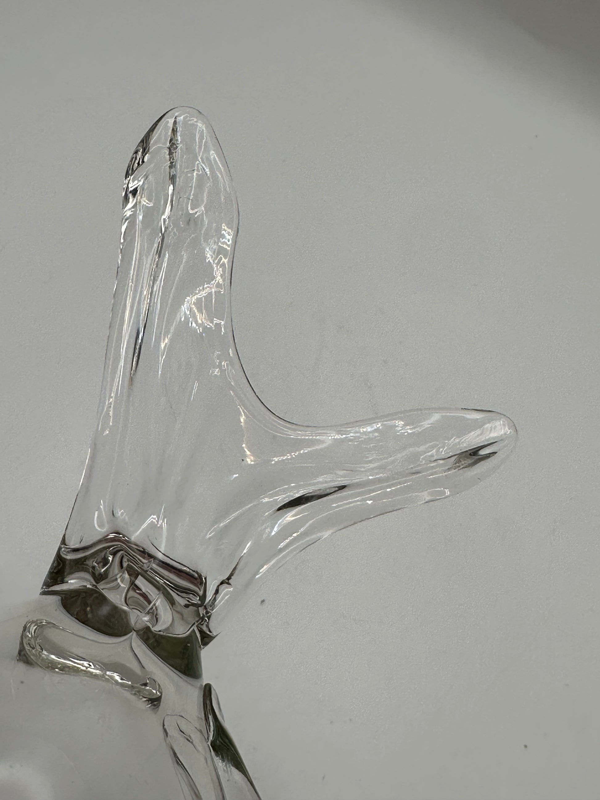 Close-up of the Blenko glass fish vase tail, clear hand-blown glass with flowing form
