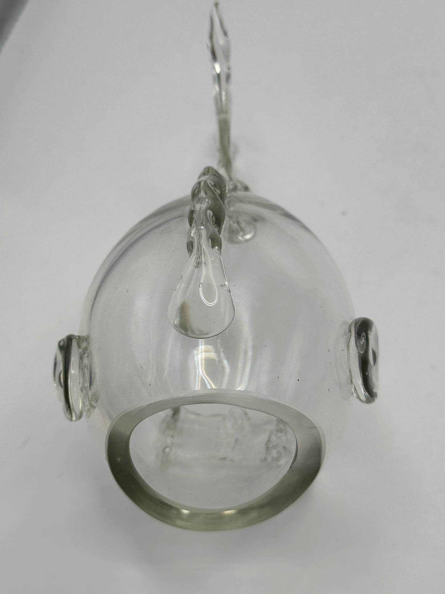 Underside view of the Blenko glass fish vase showing the round opening and applied glass fins
