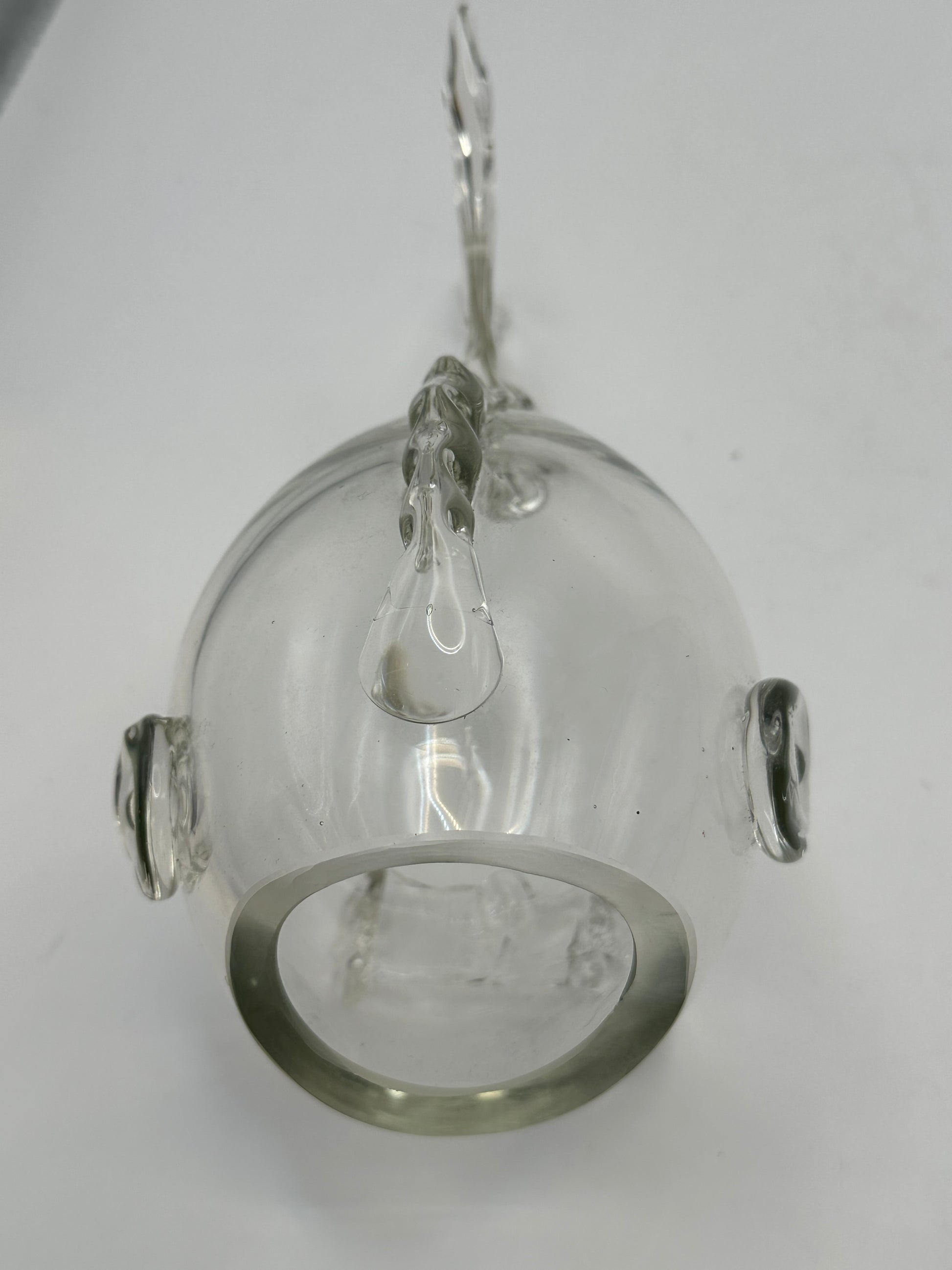Underside view of the Blenko glass fish vase showing the round opening and applied glass fins