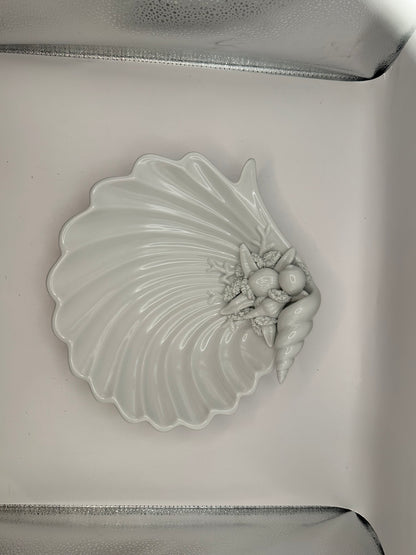 White porcelain shell dish in its box, top view with molded shell cluster
