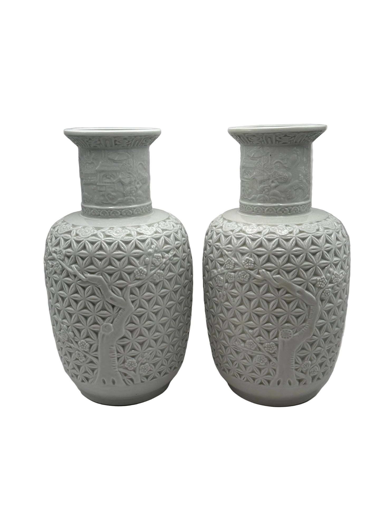 Pair of white Blanc de Chine baluster vases, close view of flared rims and carved relief