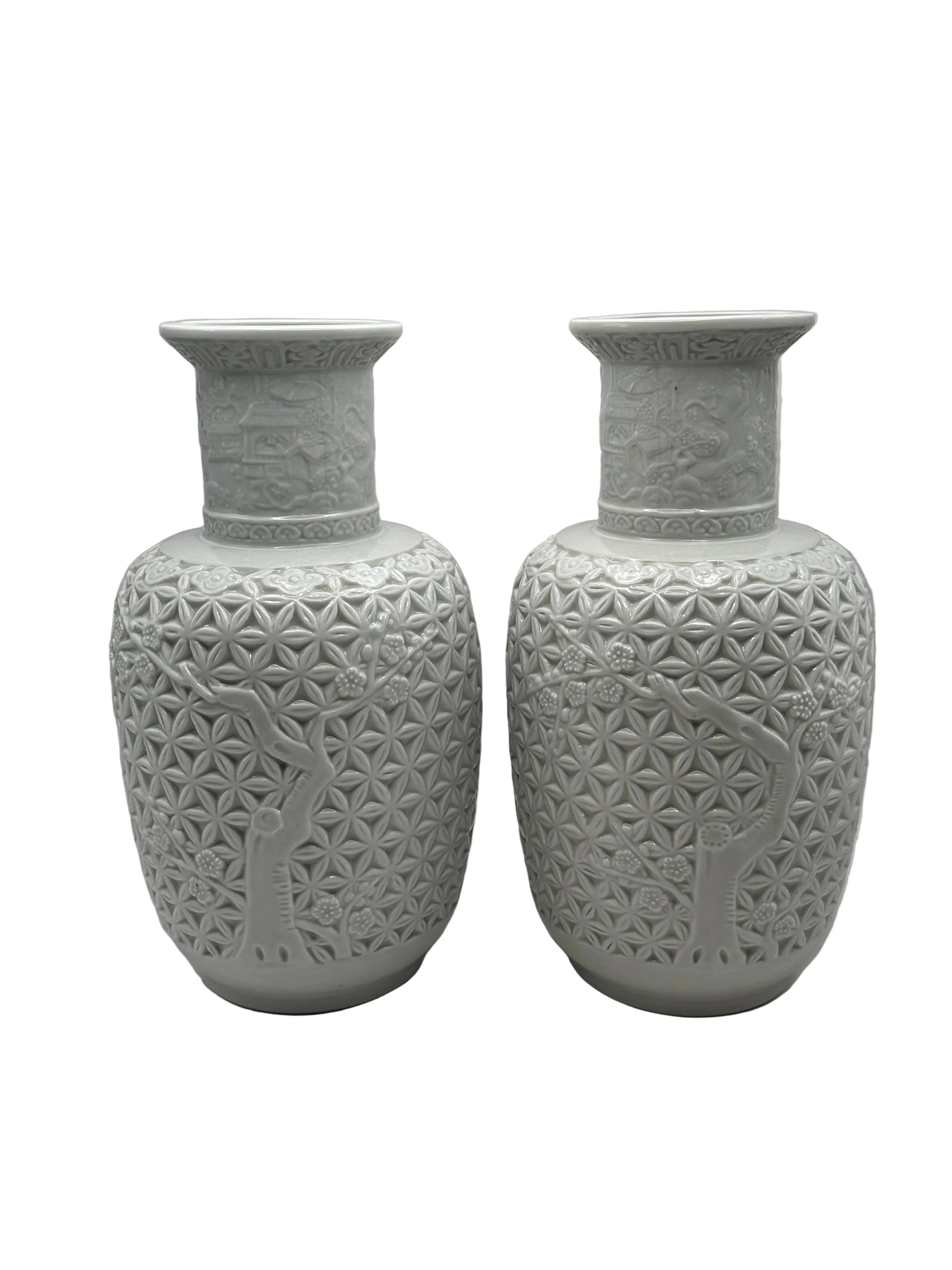 Pair of white Blanc de Chine baluster vases, close view of flared rims and carved relief