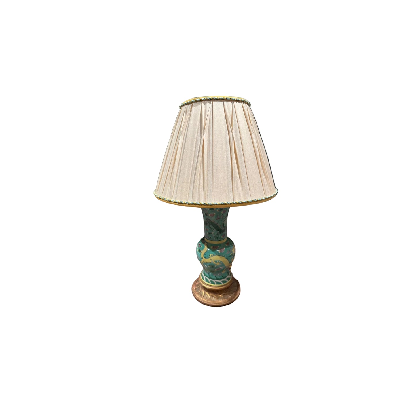 Antique Chinese porcelain dragon lamp with cream pleated shade, angled view