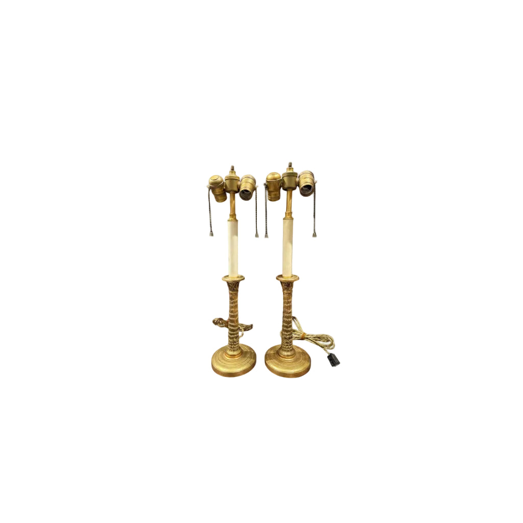 Pair of antique gilt bronze candlestick lamps with cream column stems and twin sockets, shades removed