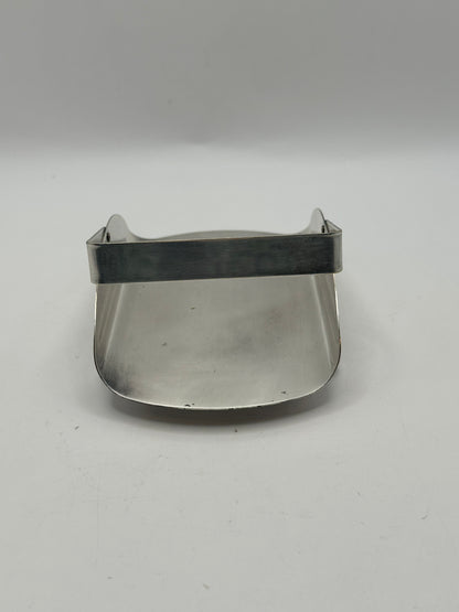 Side view of the silver-plate basket showing its sloping curved sides