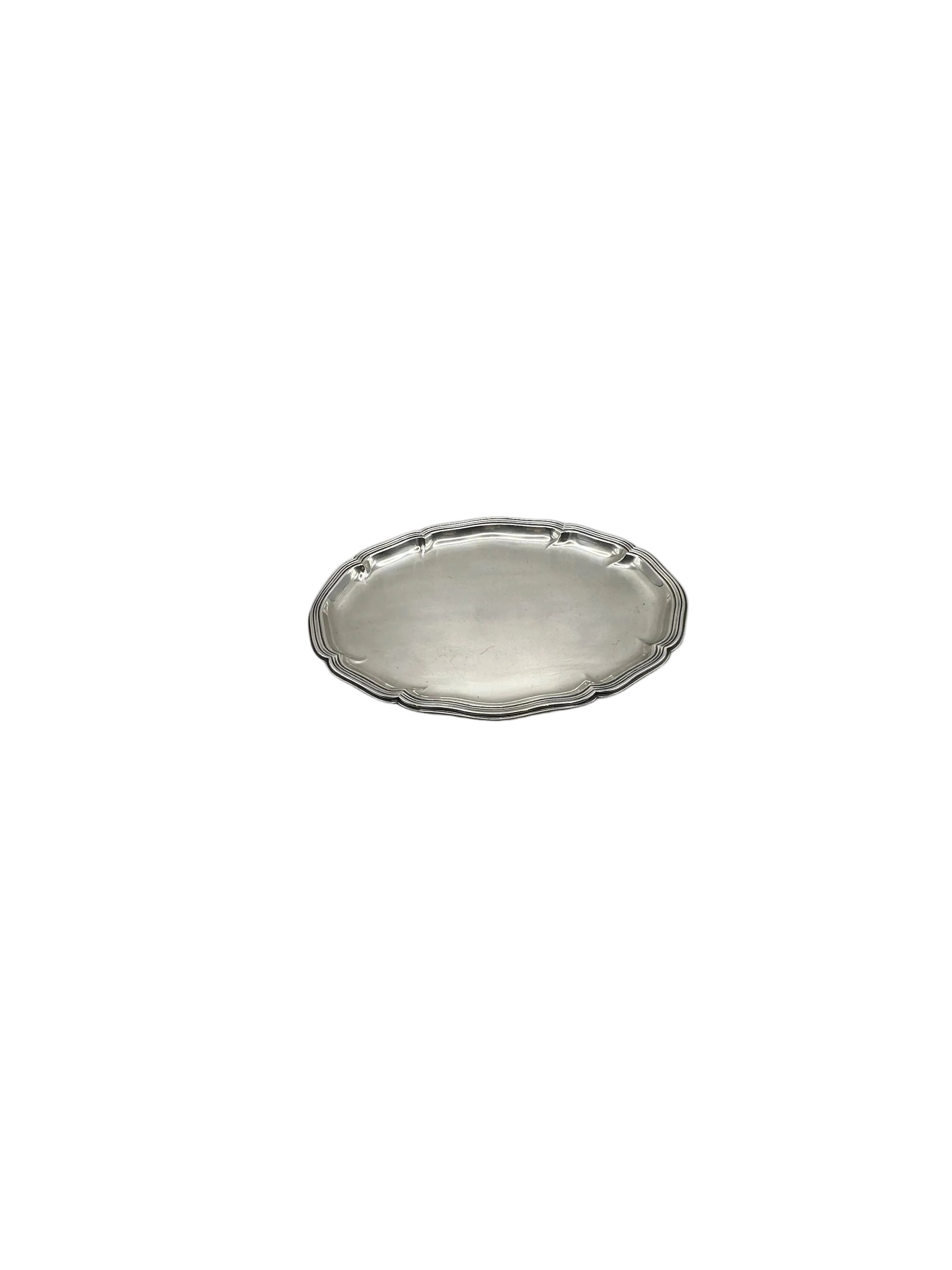 Small oval silver-plate tray with a scalloped shaped rim, angled view