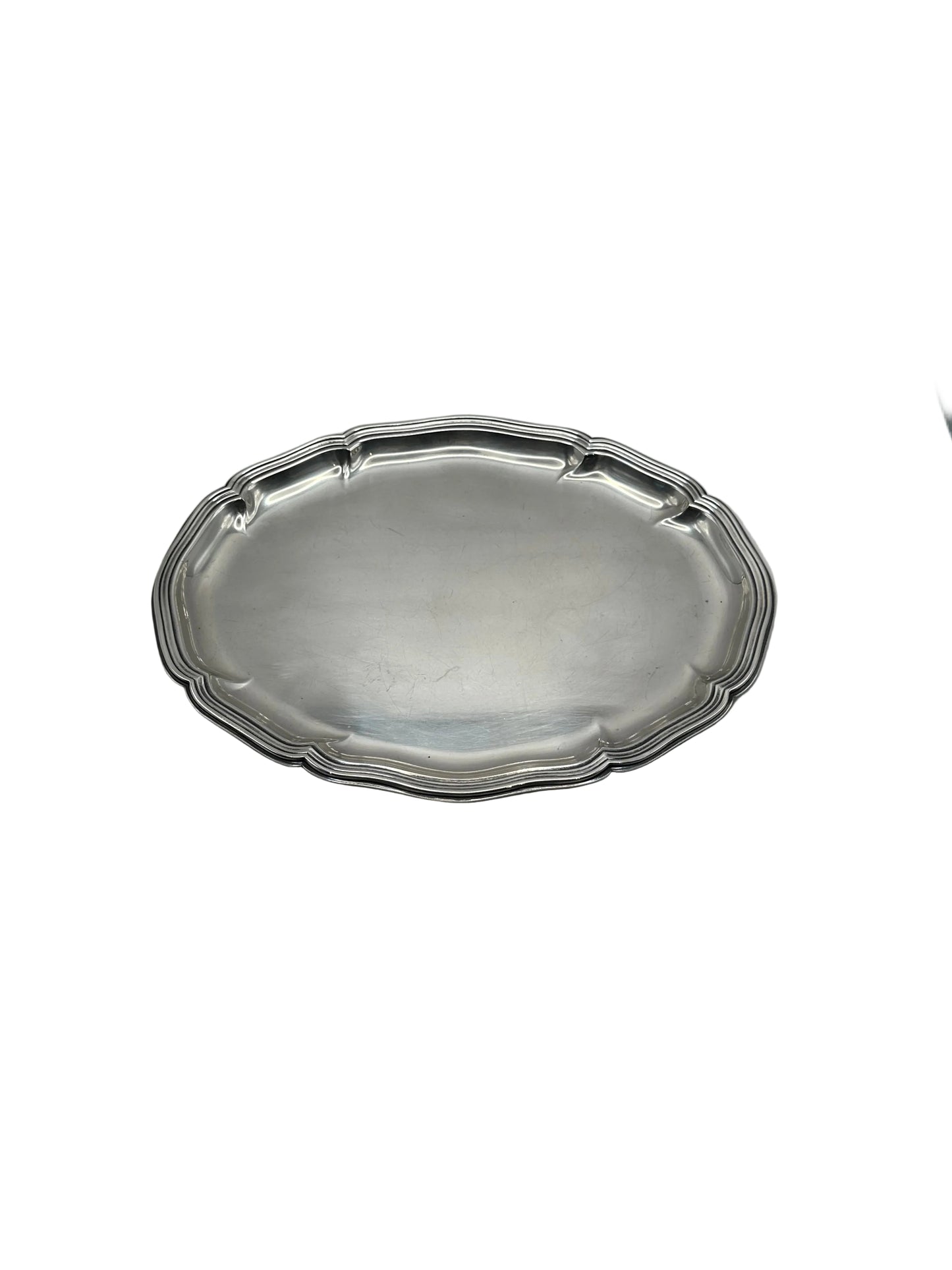 Oval silver-plate tray with a scalloped piecrust rim, top-angled view