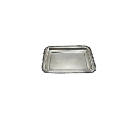 Small rectangular silver-plate tray with a beaded rim, angled view