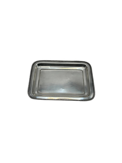 Top view of the small rectangular silver-plate tray with a beaded edge