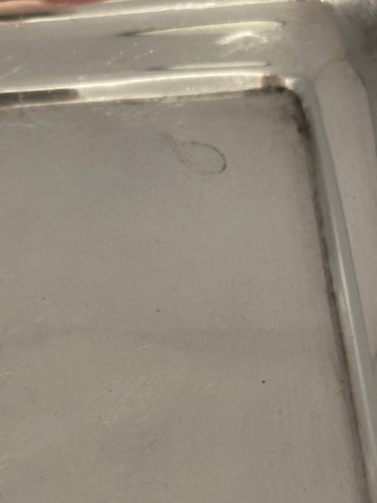 Close-up of the tray's inner corner showing the recessed well and edge
