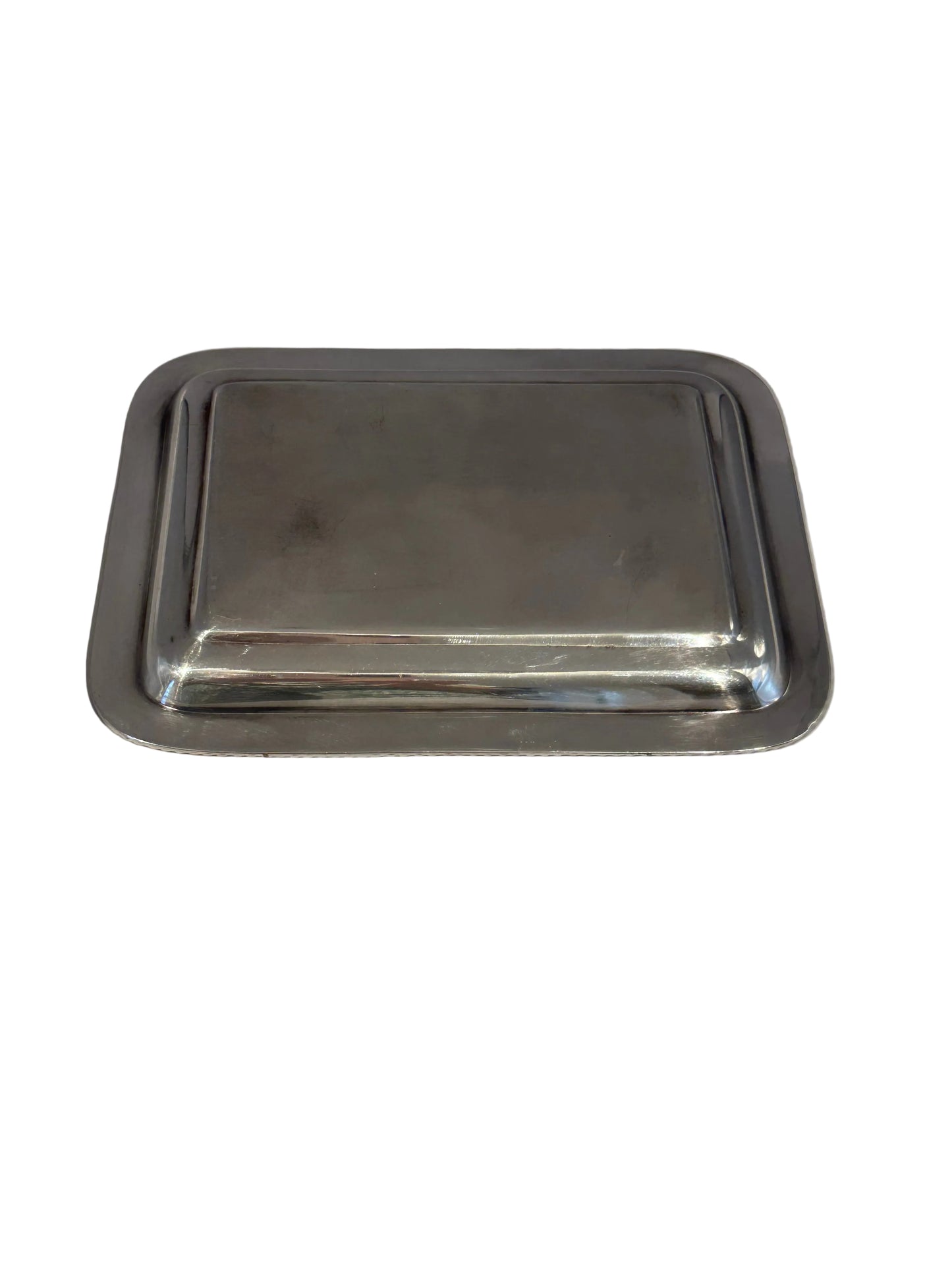 Underside of the rectangular silver-plate tray, angled view