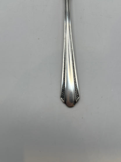 Close-up of the spoon's beaded Art Deco handle tip