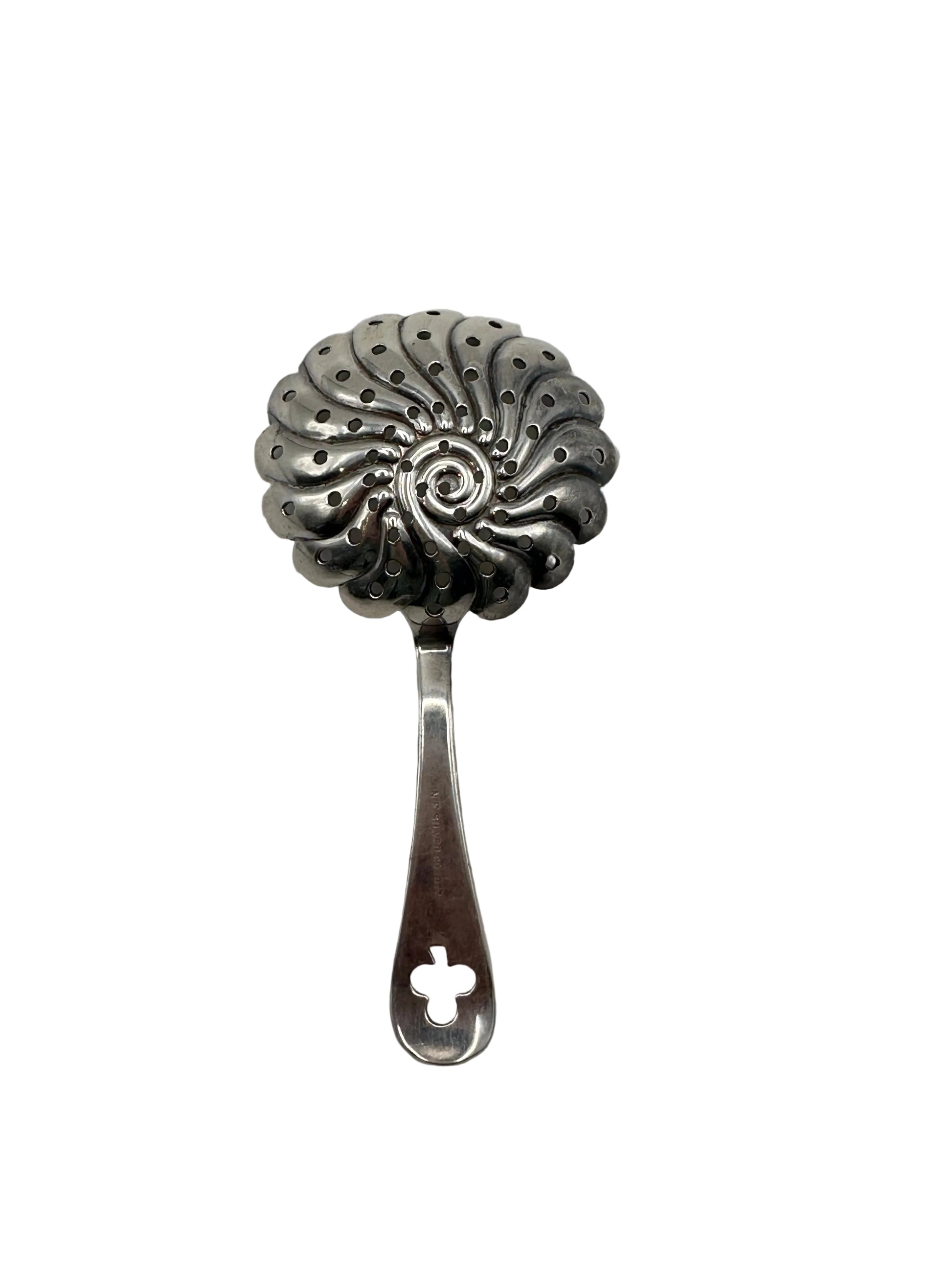 Front view of the silver strainer's pierced swirled bowl and slotted handle