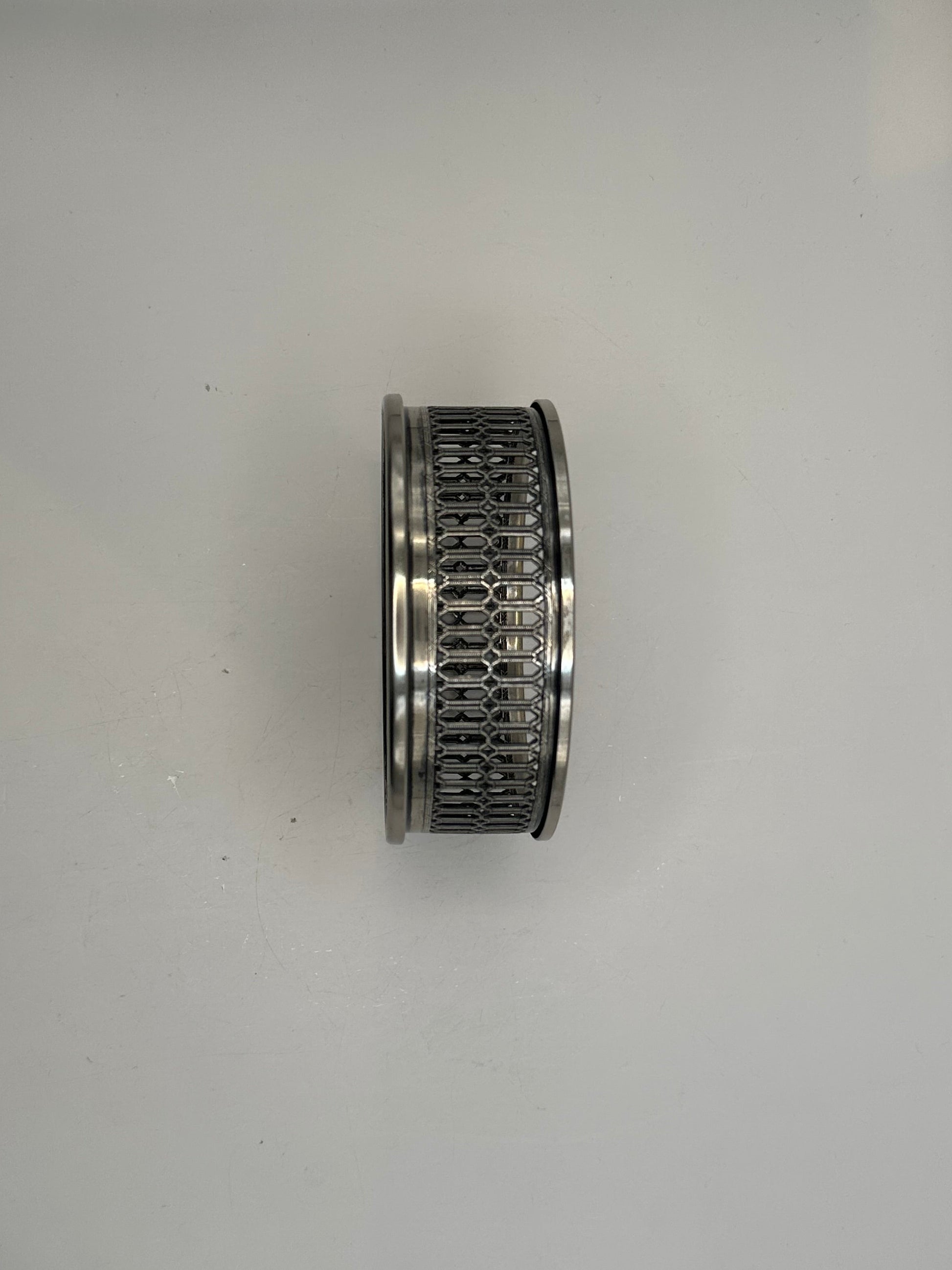 Side profile of the bottle coaster showing the pierced silver lattice gallery