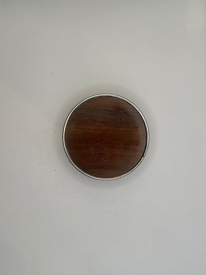Top-down view of the bottle coaster showing its turned wood base