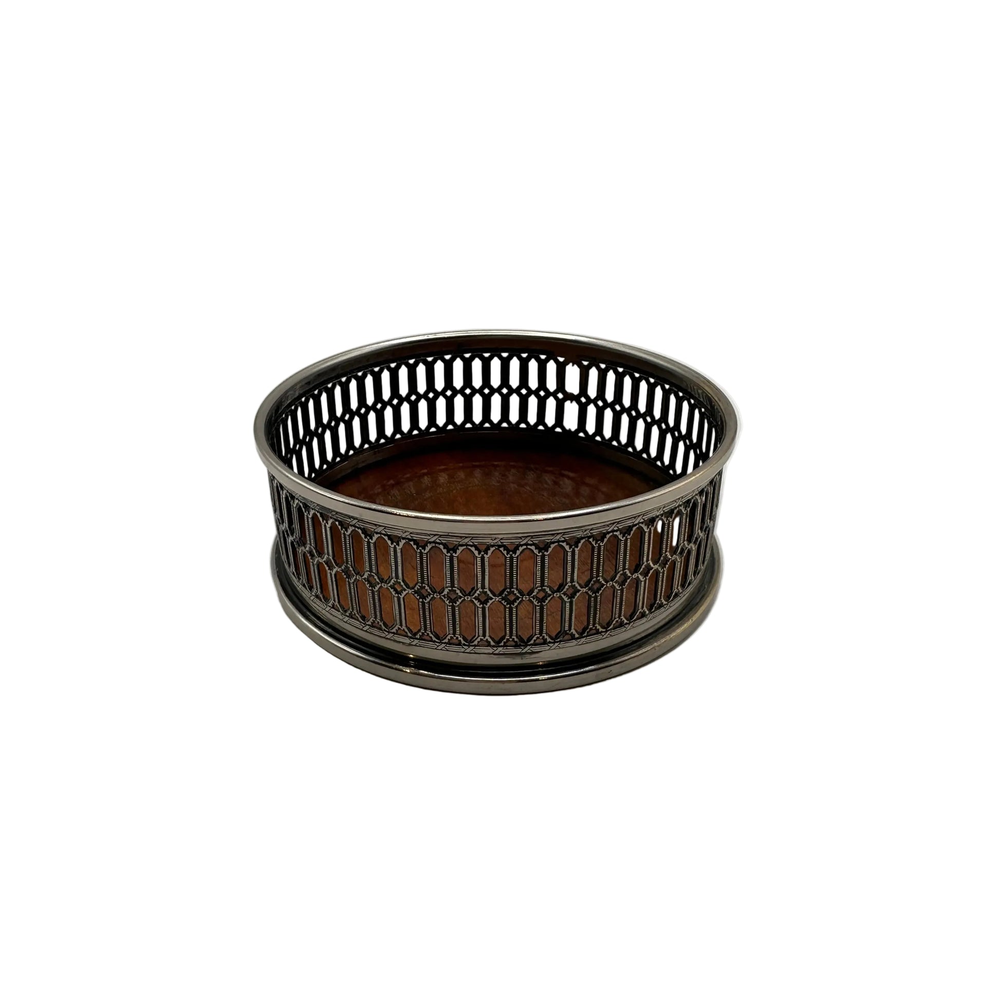 Silver-plate wine bottle coaster with a pierced lattice gallery and turned wood base, angled view