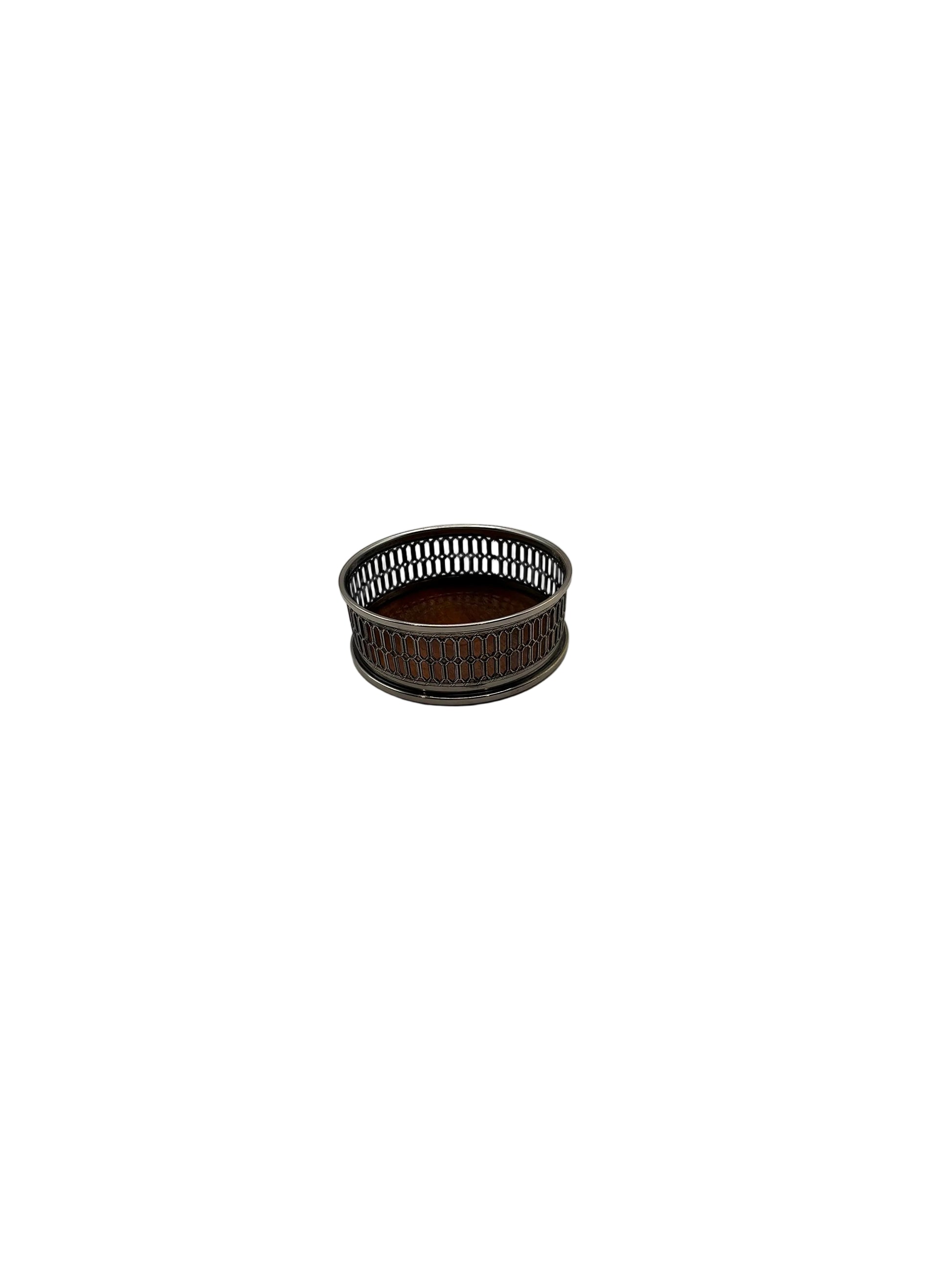 Side view of the pierced silver-plate bottle coaster with its wood base