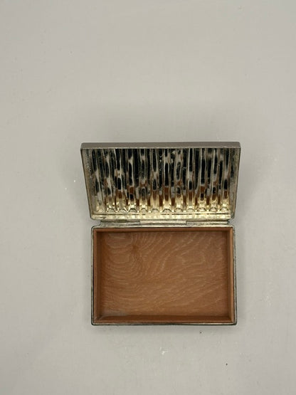 Open MCM silver plate box from above, ribbed lid raised and empty wood-lined base