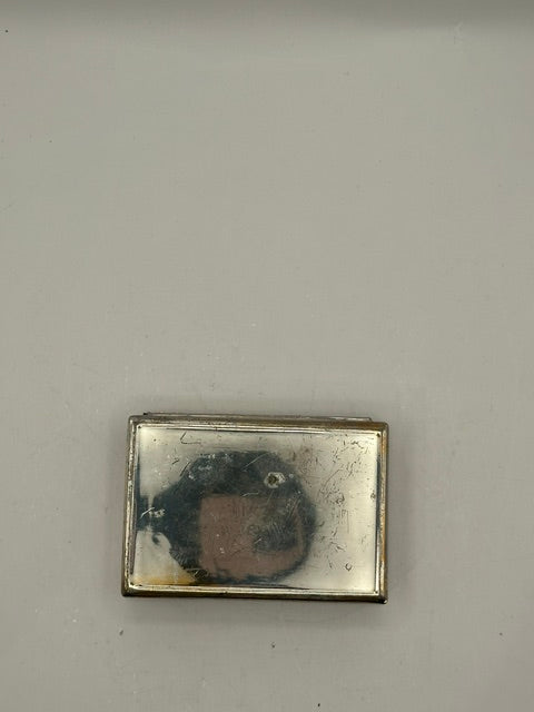 Underside of MCM silver plate box showing scuffed, tarnished base