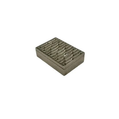 MCM silver plate bamboo-motif box viewed from above at an angle, embossed lid