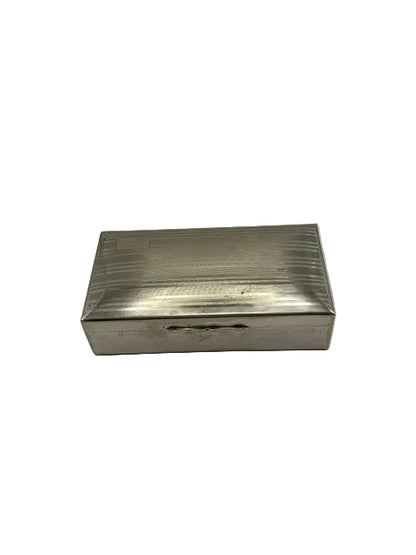 Rectangular silver-plate cigarette box with a linear engine-turned lid, top view