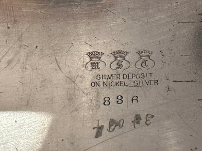 Maker's mark reading 'Silver Deposit on Nickel Silver' with three crowned letters and the number 836