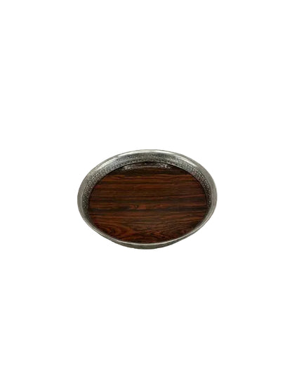 Round gallery tray with a rosewood base and pierced silver-plate rim, top view