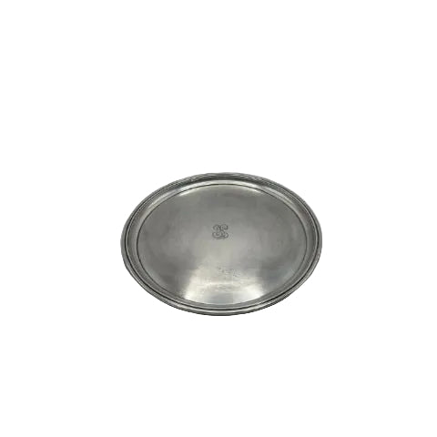 Round silver-plate serving tray, top view, with a beaded rim and engraved script monogram at center