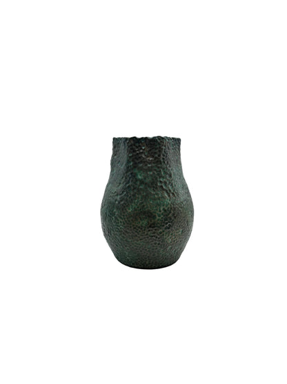 Tall green stoneware vessel with dimpled texture and a rippled rim, front view on white