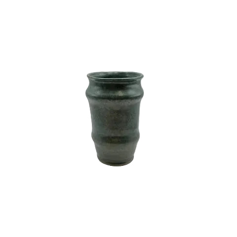 Top view into the green satin-glazed stoneware vessel showing its dark interior