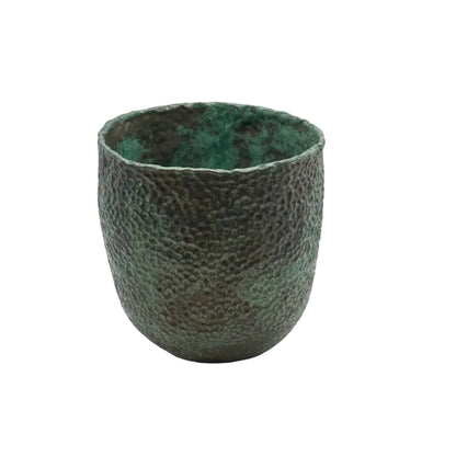 Wide-mouth green stoneware vessel with hammered texture, angled view
