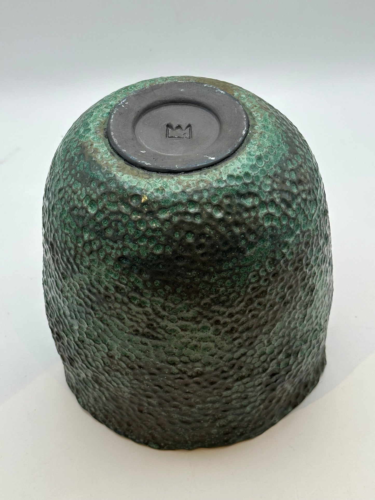 Underside of the wide-mouth vessel showing the recessed base with a crown maker's mark