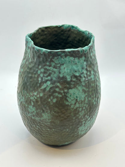 Medium green stoneware vessel with hammered texture and an irregular rim