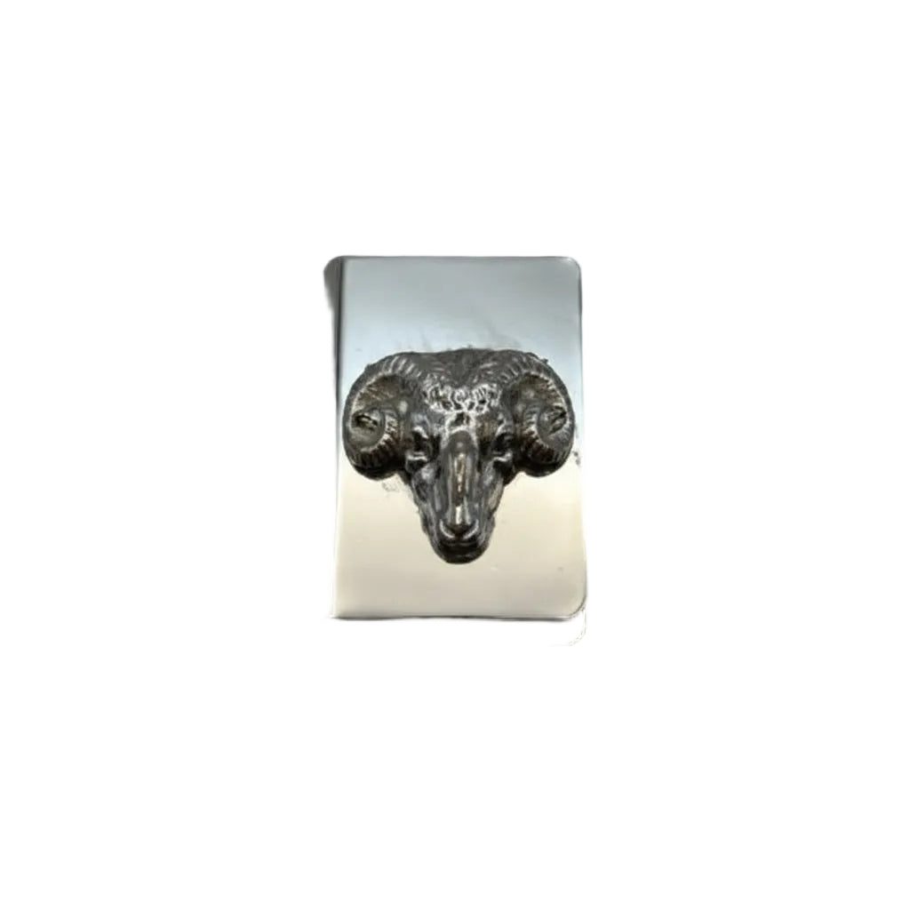Silver-plate matchbox cover with embossed ram's head in relief, front view