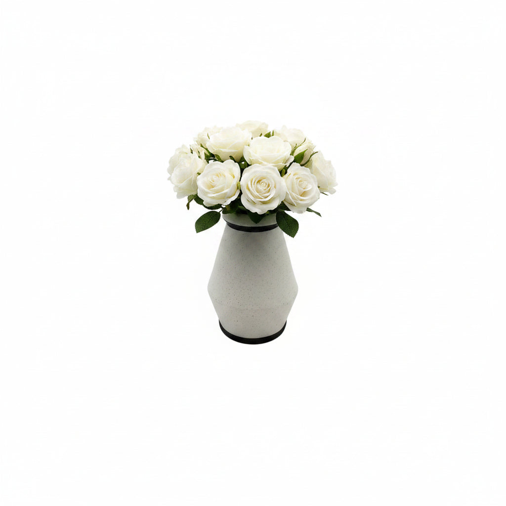 Studio-made white stoneware vessel styled with a bouquet of white roses.