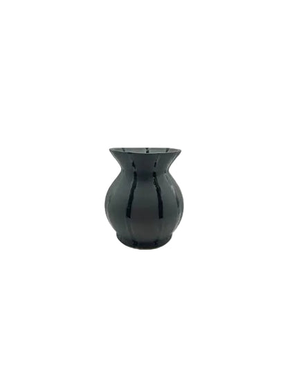 Studio-made obsidian-black striped ceramic vessel with flared rim, front view on white