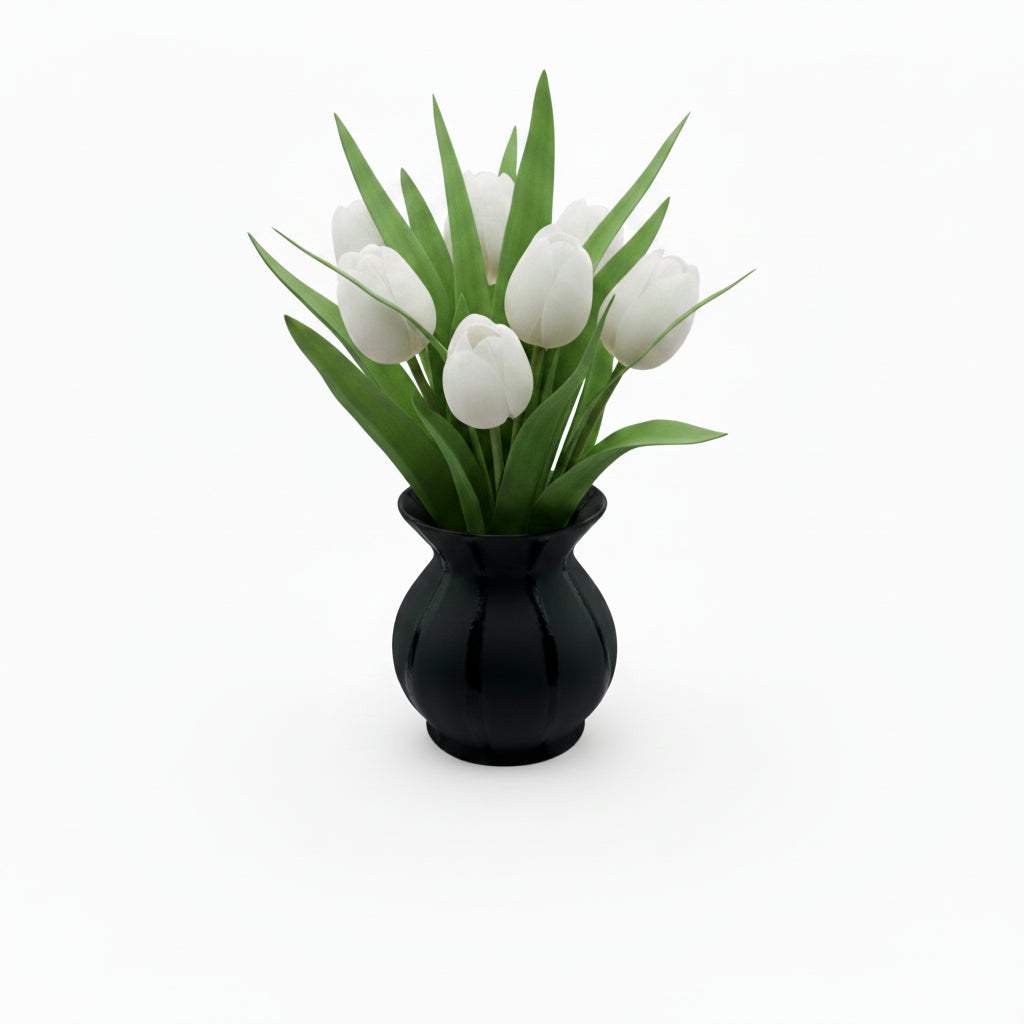 Black striped ceramic vessel holding white tulips, styled on white background
