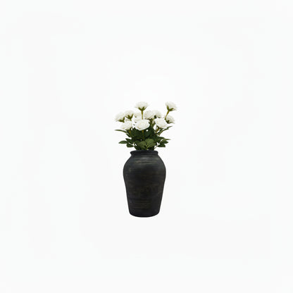 Black matte ribbed ginger-jar ceramic vase holding white roses, front view