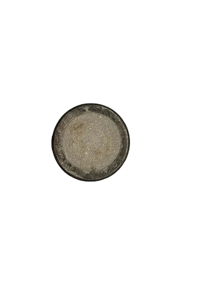 Top-down view of the handmade vase's unglazed sandy base with dark rim