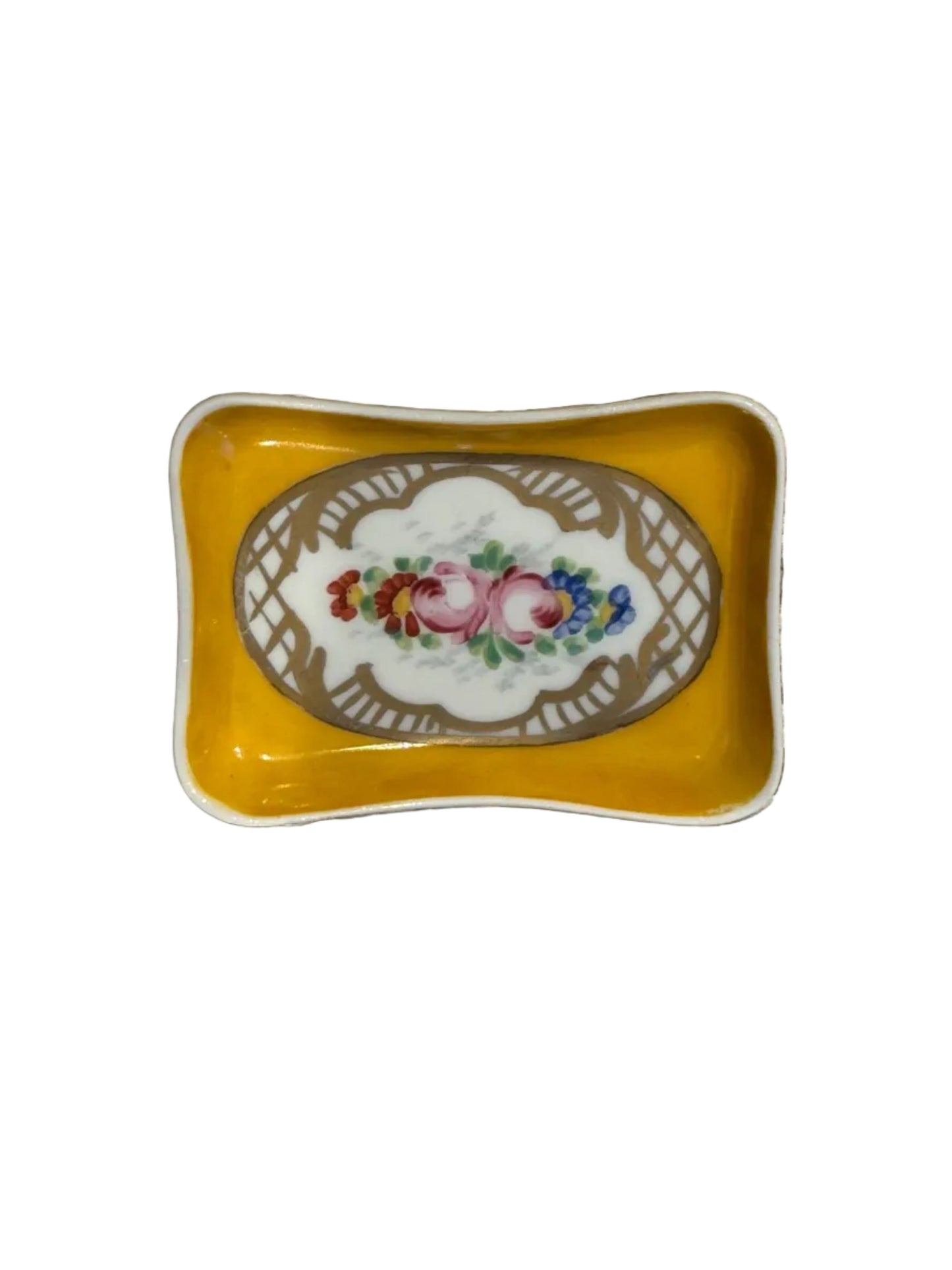 Vintage French hand-painted trinket dish, golden-yellow porcelain with floral spray in gilt lattice frame, top view