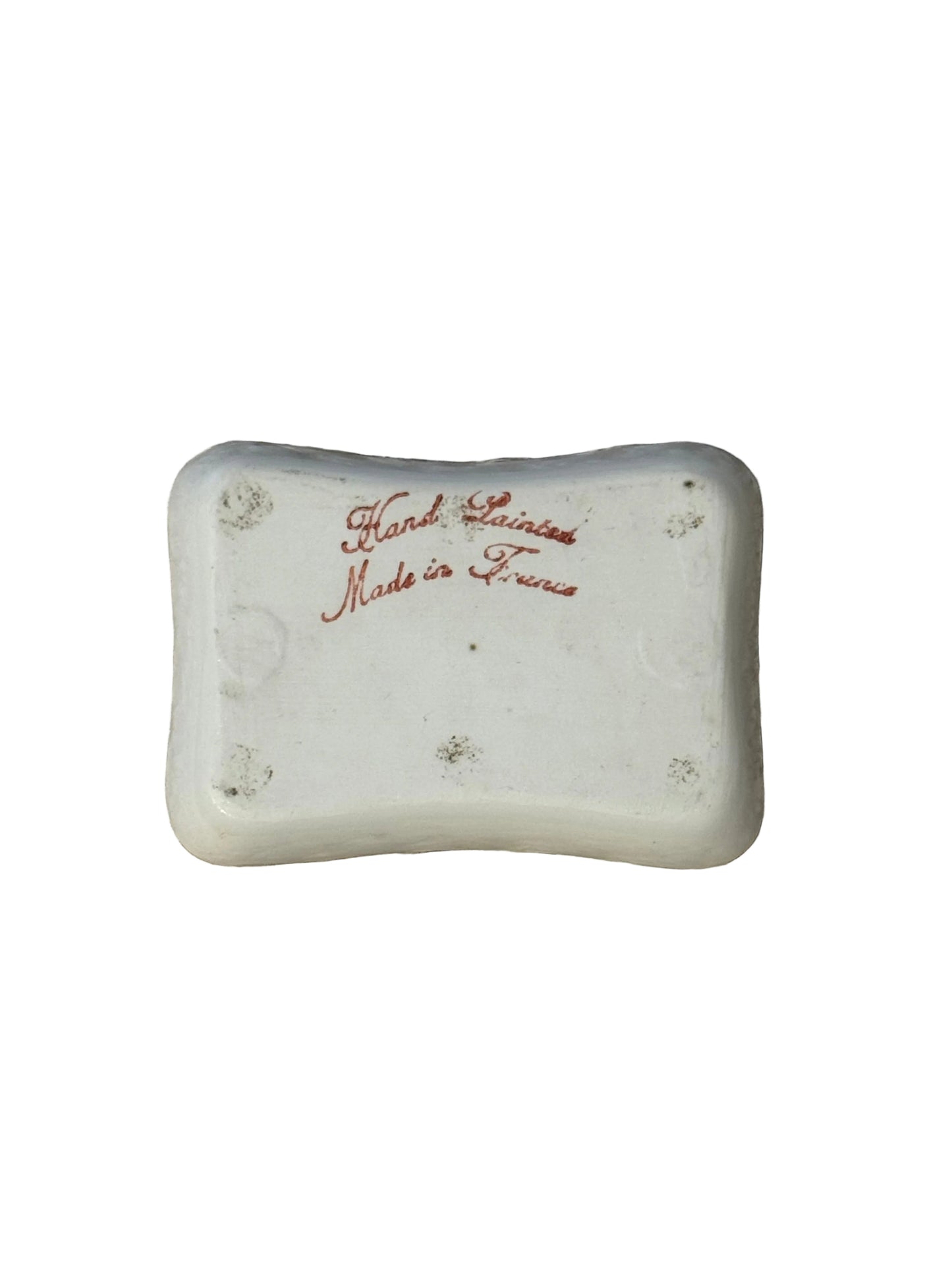 Underside of the French trinket dish with red script mark reading Hand Painted, Made in France